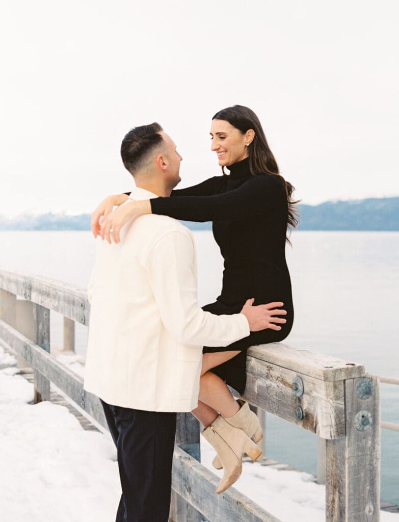 A romantic engagement session at snowy Lake Tahoe, featuring a couple in love against a picturesque winter backdrop.