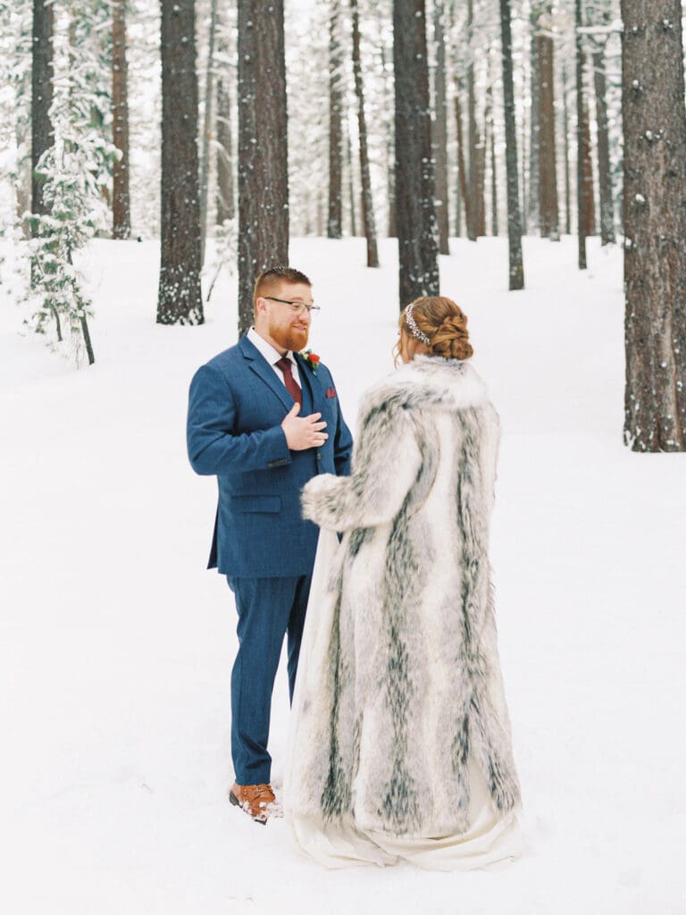 first look at snowy Lake Tahoe winter wedding 