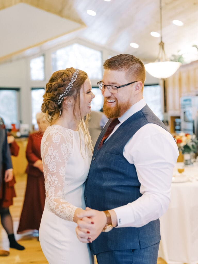 Bride and groom dance at the Cozy Lake Tahoe Cabin Winter Micro Wedding