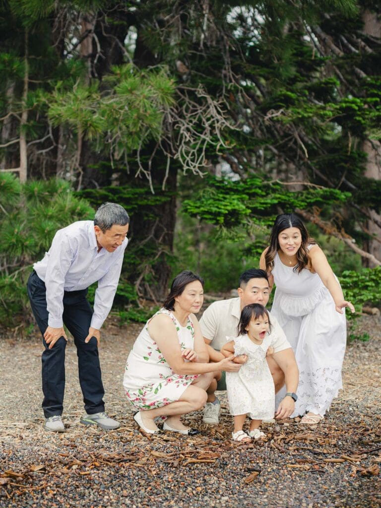 A family poses together for a photo in front of a tree during their photography session in South Lake Tahoe.