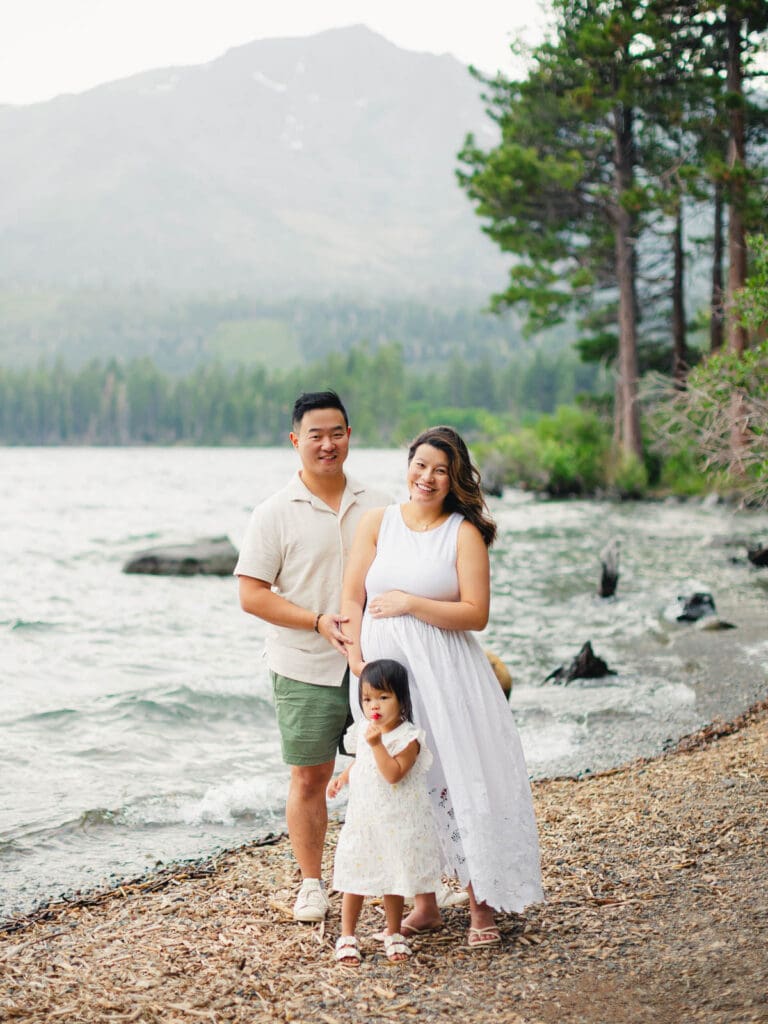 A family poses together for a photo by the lake during their photography session in South Lake Tahoe.