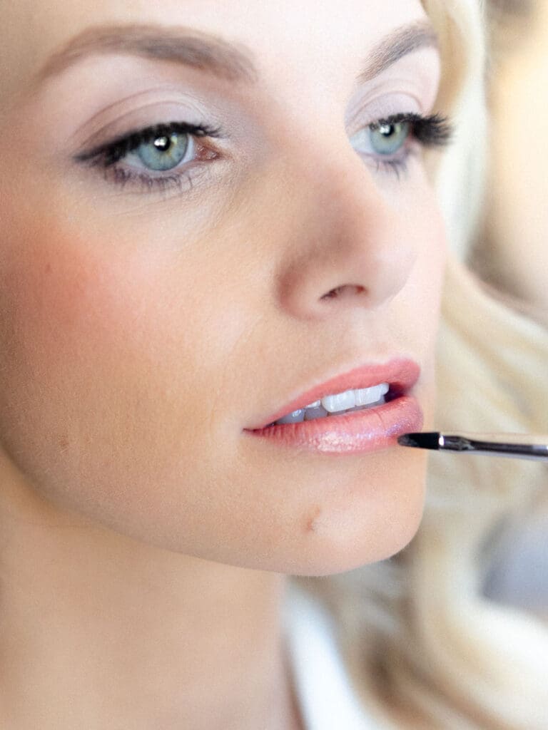 Bride putting makeup on during getting ready portraits at Everline Resort, Lake Tahoe.