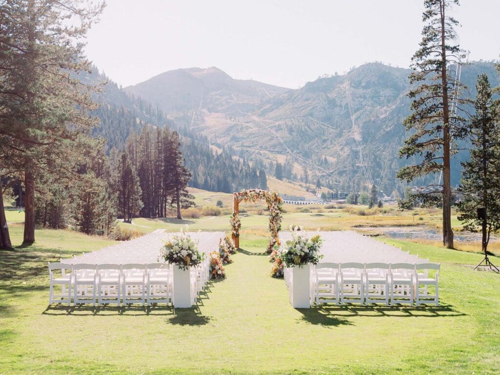 A picturesque wedding ceremony decor at Everline Resort, set against the stunning backdrop of Lake Tahoe's mountains.