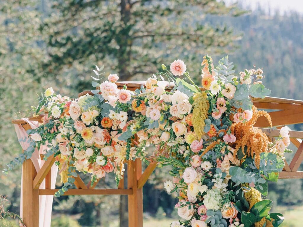 A picturesque wedding ceremony flowers at Everline Resort, set against the stunning backdrop of Lake Tahoe's mountains.