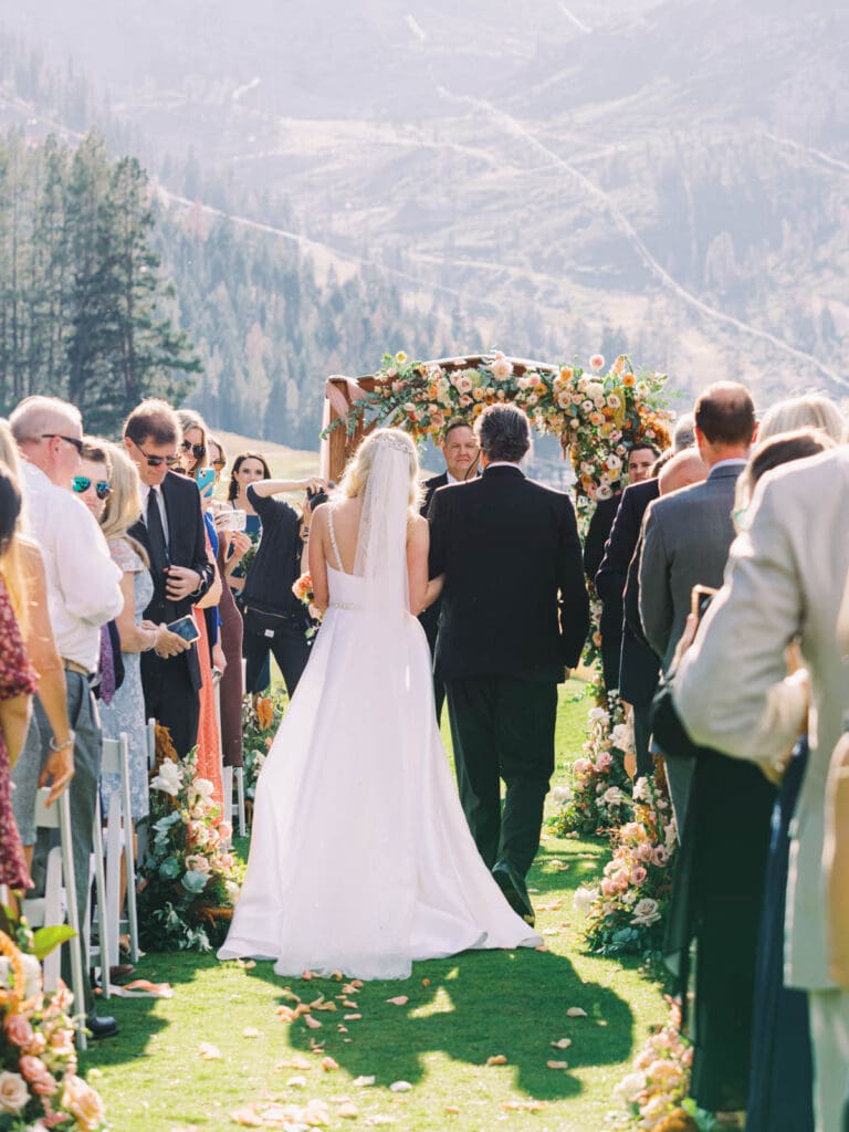 A picturesque wedding ceremony at Everline Resort, set against the stunning backdrop of Lake Tahoe's mountains.