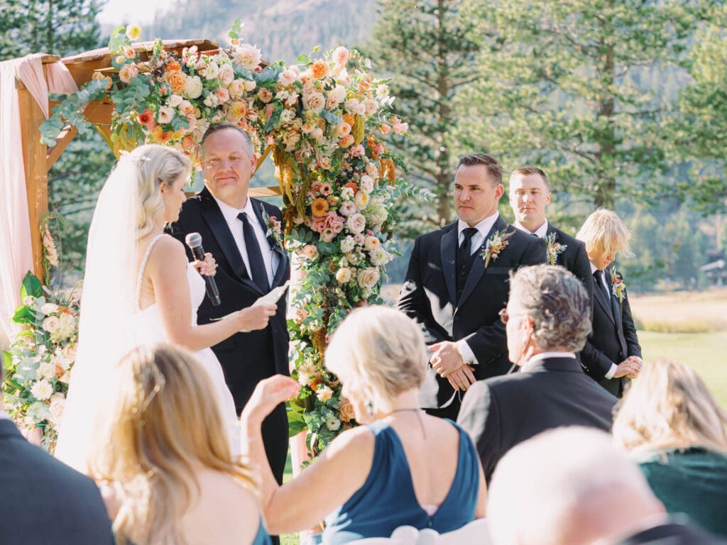 A picturesque wedding ceremony at Everline Resort, set against the stunning backdrop of Lake Tahoe's mountains.