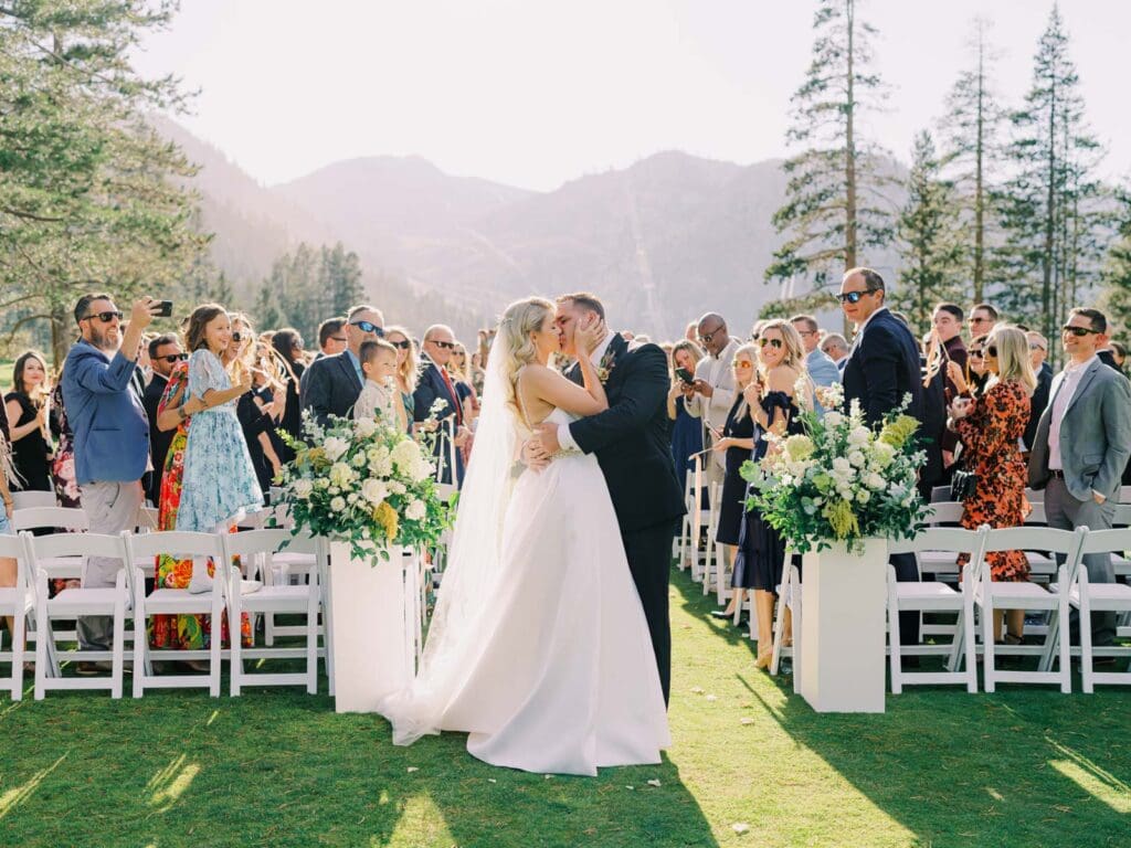 A picturesque wedding ceremony at Everline Resort, set against the stunning backdrop of Lake Tahoe's mountains.