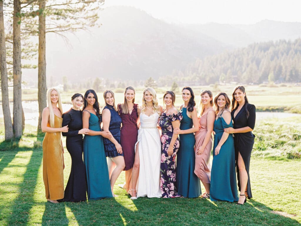 A stunning bride and her friends captured by Lake Tahoe wedding photographer at Everline Resort, set against the beautiful Lake Tahoe mountains.