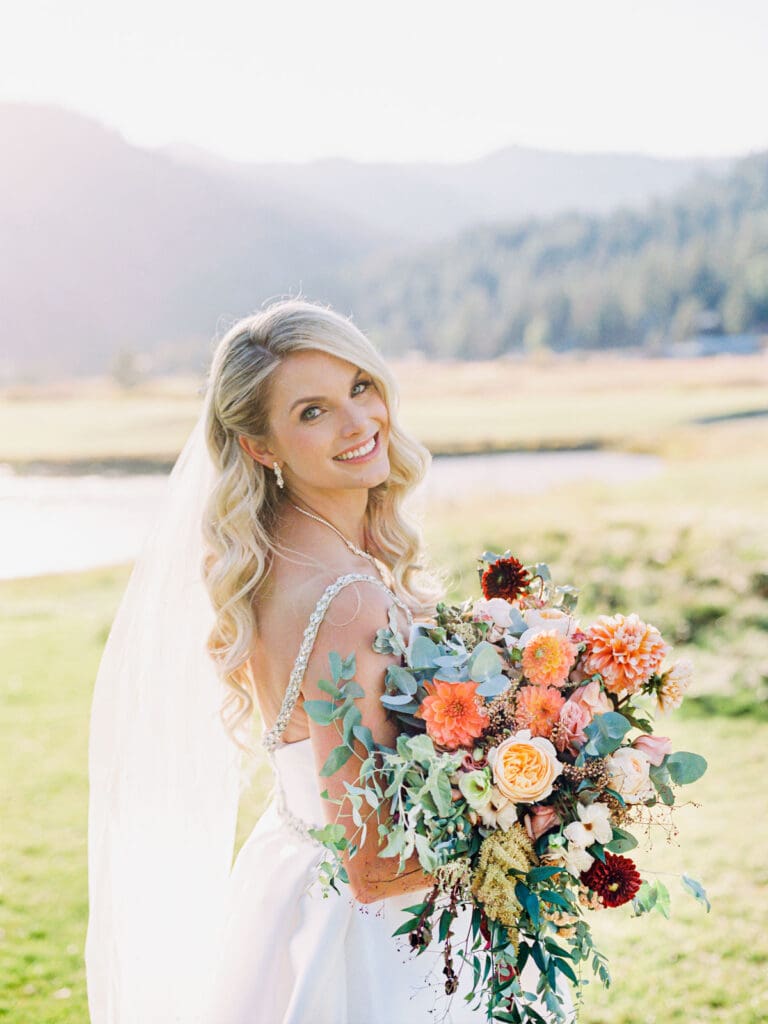 A stunning bride captured by Lake Tahoe wedding photographer at Everline Resort, set against the beautiful Lake Tahoe mountains.