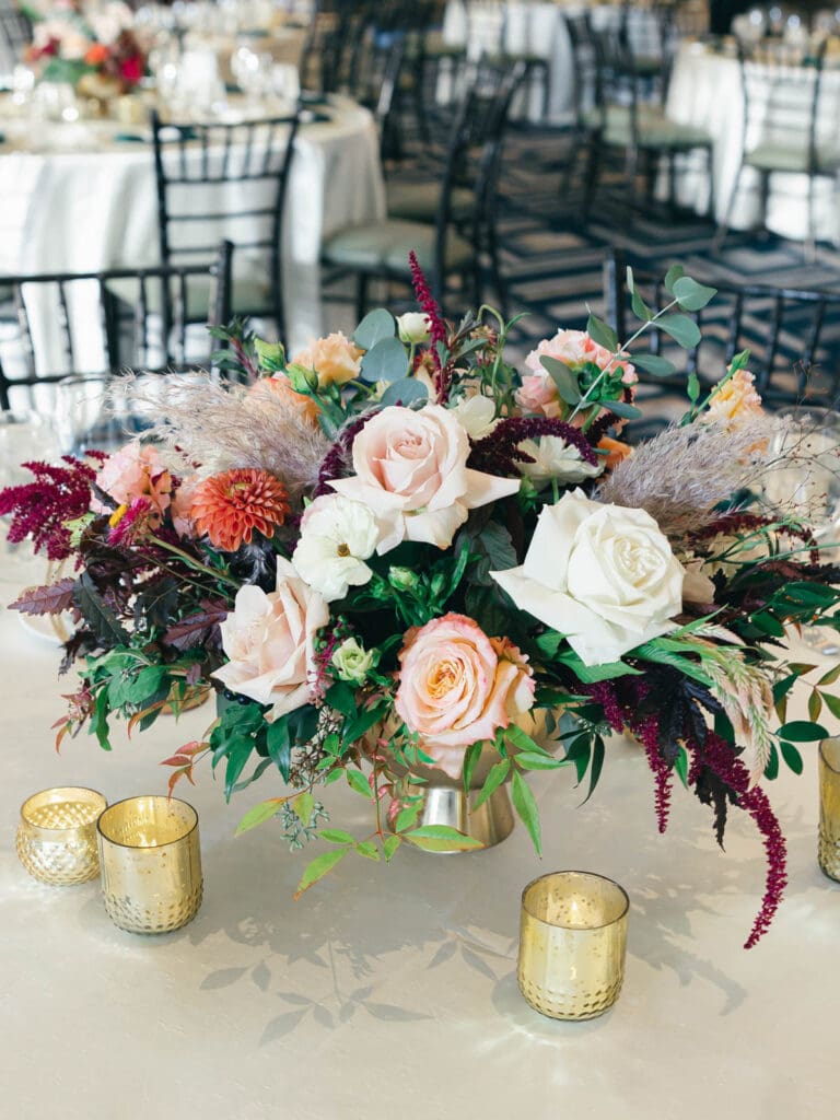 Elegant wedding reception at Everline Resort, Lake Tahoe, featuring, flowers, beautifully arranged tables and chairs for guests.