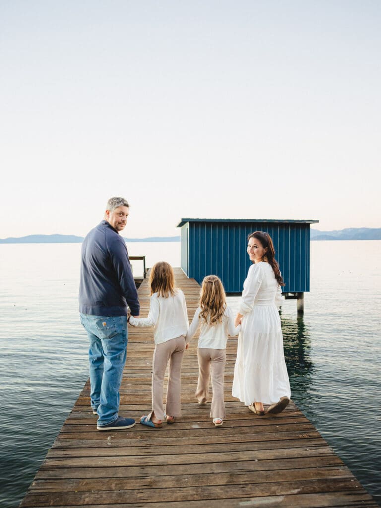 A family walking on the dock, part of a family photo session in South Lake Tahoe.