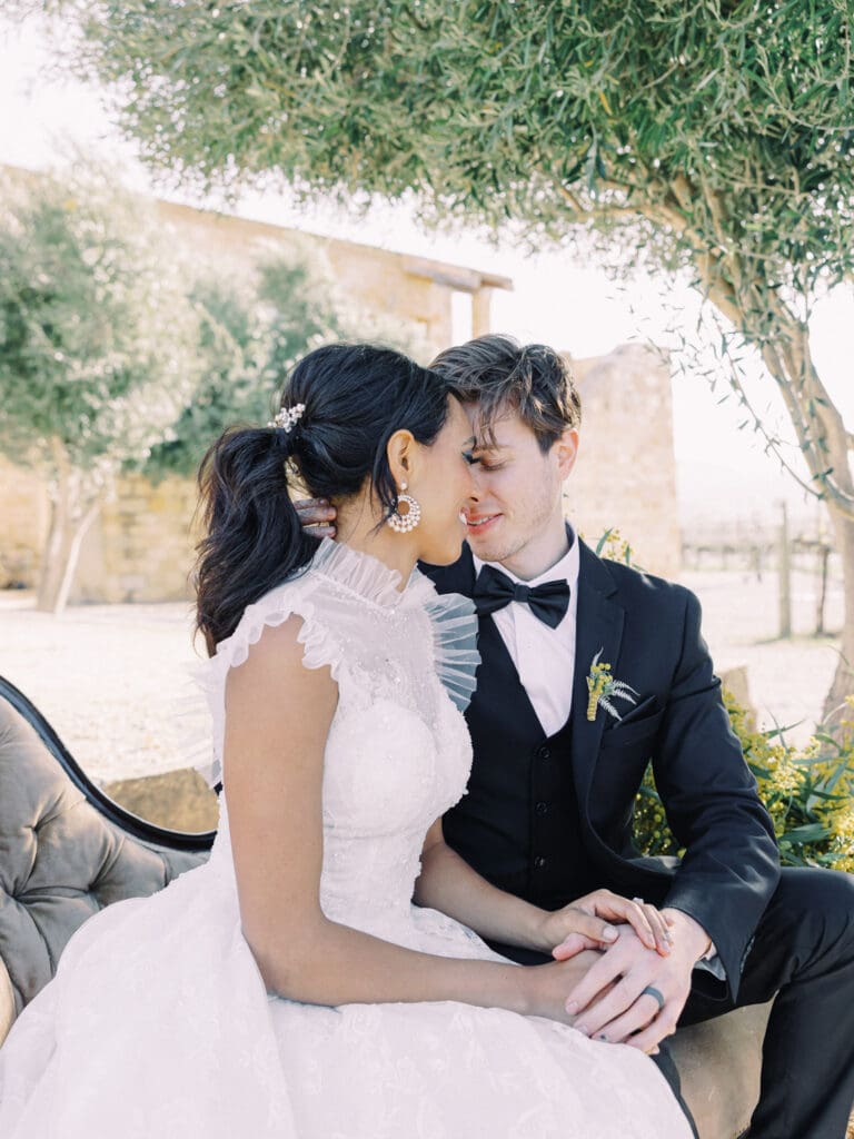 Bride and Groom kissing portraits at Sunstone Villa - Sunstone Winery and Vineyards olive grove wedding 