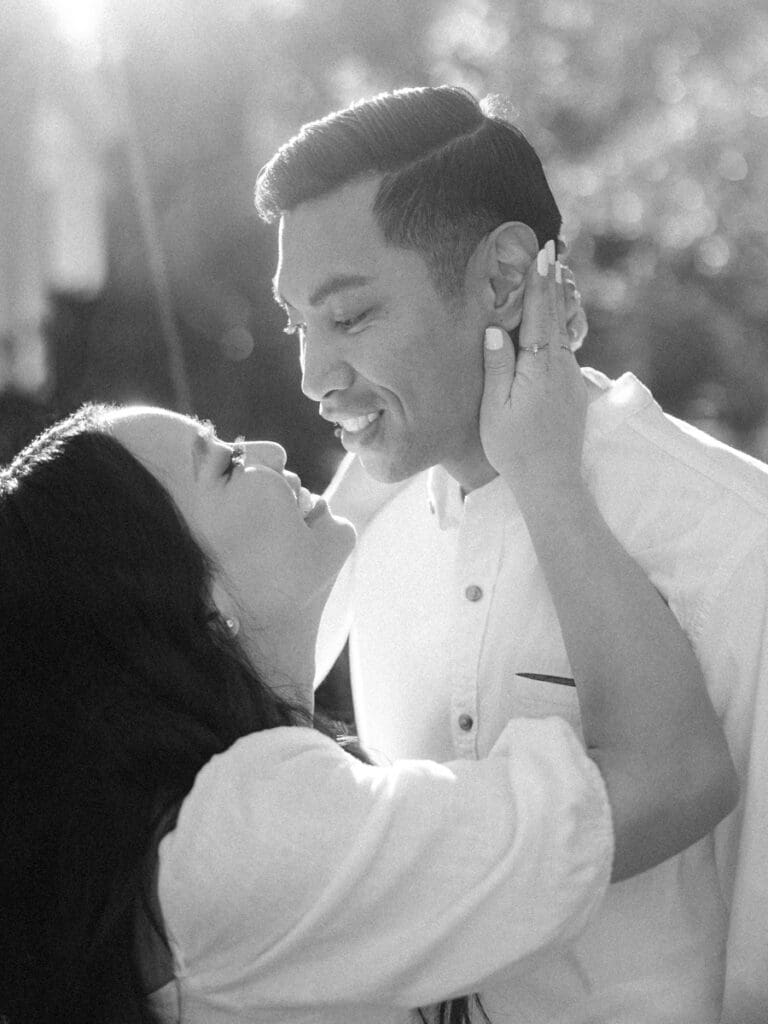 Couple embracing at romantic Villa Montalvo engagement session in San Francisco, showcasing a couple's love amidst stunning landscapes.