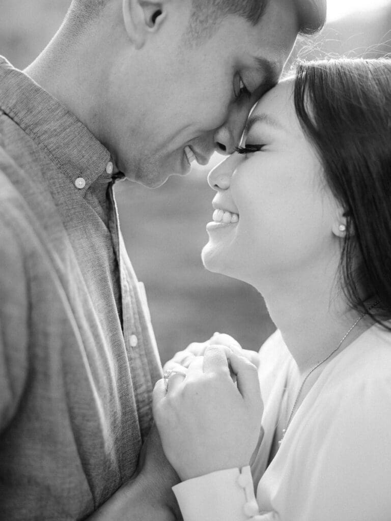 Couple embracing at romantic Villa Montalvo engagement session in San Francisco, showcasing a couple's love amidst stunning landscapes.