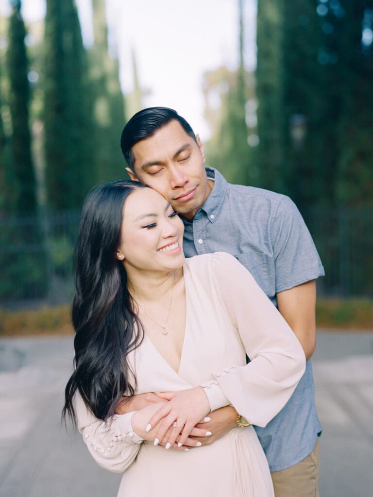 Couple embracing at romantic Villa Montalvo engagement session in San Francisco, showcasing a couple's love amidst stunning landscapes.