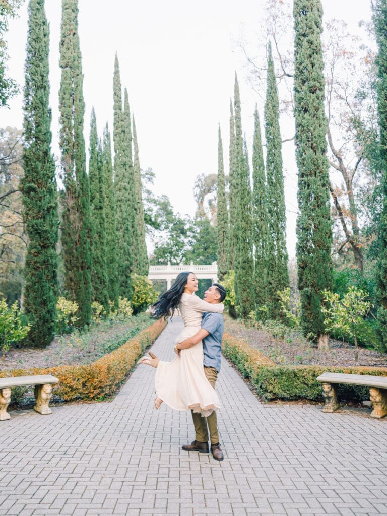 Couple having fun at romantic Villa Montalvo engagement session in San Francisco, showcasing a couple's love amidst stunning landscapes.